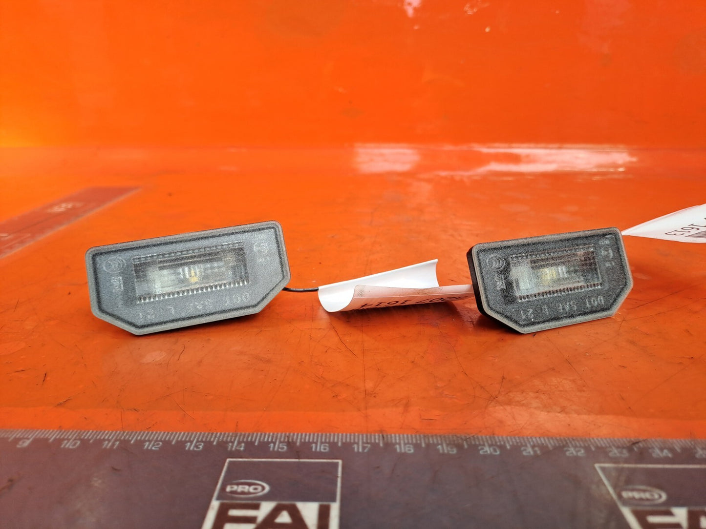 TESLA MODEL 3 LONG 2024 LICENCE PLATE LIGHT PAIR 1713282-00-A Warranty A207 - Image 1